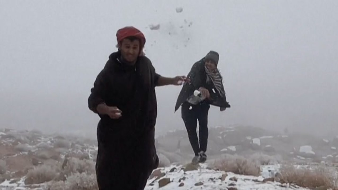 People in Saudi Arabia visit mountain to experience the cold weather
