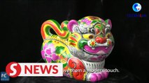 Chinese artist makes clay tigers to welcome Lunar New Year