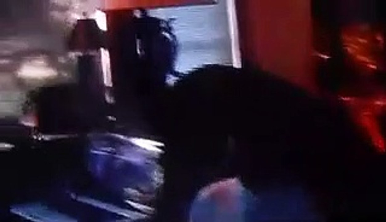 Christopher  playing the  wii  while  Jonathan & Anthony  watch