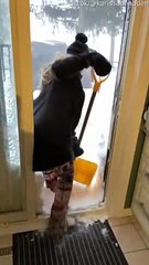 Woman Slips While Shoveling Snow