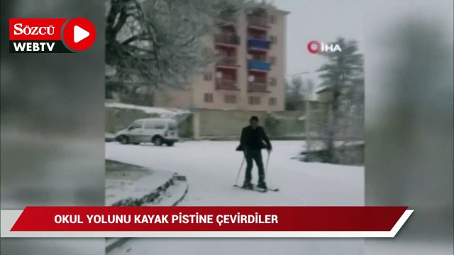 Okul yolunu kayak pistine çeviren öğretmen, kayarak okula gidiyor