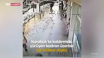 Yürürken kafasına kar kütlesi düştü