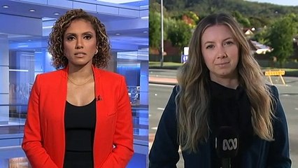 Police negotiating with two men inside a Nerang property