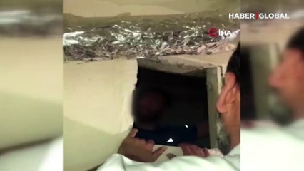 Download Video: Aranan şahsı havalandırma boşluğunda yakalayan polis: 