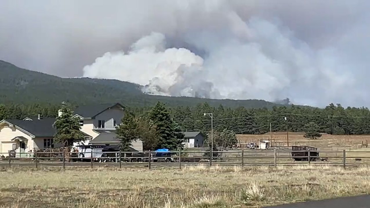 Wildfire smoke envelopes mountain top