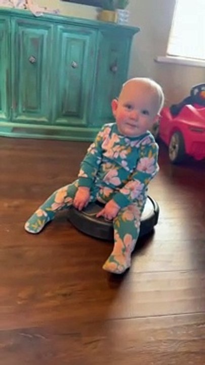 Thrill-seeking baby goes for ride on robot vacuum