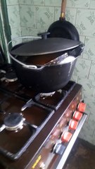 Boil an old frying pan to remove the soot