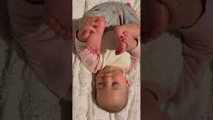 Baby Falls Asleep Holding Her Feet