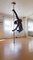Dance Instructor Balances With His Feet on Pole