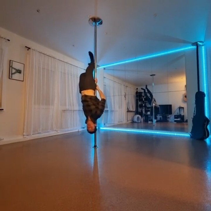 Dance Instructor Does Impressive Balancing Tricks on Pole