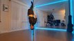 Dance Instructor Does Impressive Balancing Tricks on Pole