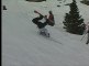 Snowboarder Tumbles While Posing After Jumping From Ramp