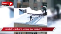 Çocuğu iple bağlayıp çatıdaki karı temizletti