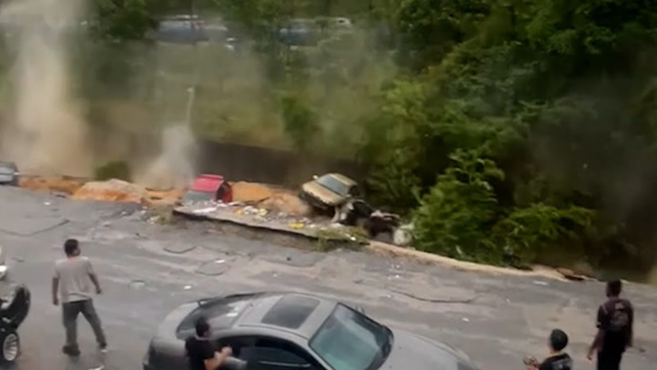 Video captures terrifying landslide, crumbling street and engulfing cars