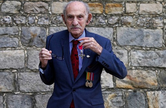 Prince William presents MBE to a 102-year-old magician