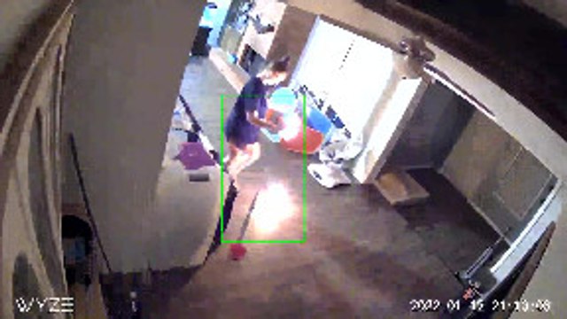 Woman Panics as She Holds onto Burning Object