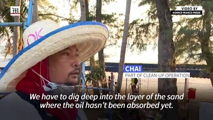 Workers scramble to clean oil slick from Thai beach