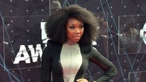Brandy Channels Whitney Houston’s 1991 Super Bowl Look With White Tracksuit To Sing National Anthem
