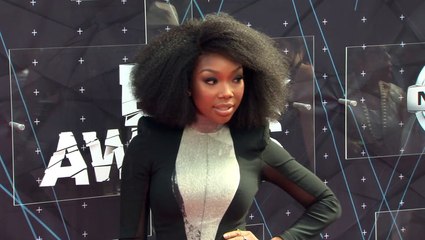Brandy Channels Whitney Houston’s 1991 Super Bowl Look With White Tracksuit To Sing National Anthem