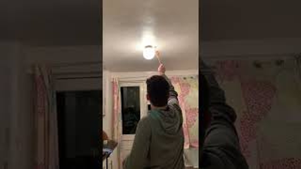 Guy Smashing Bug Breaks Kitchen Light Cover