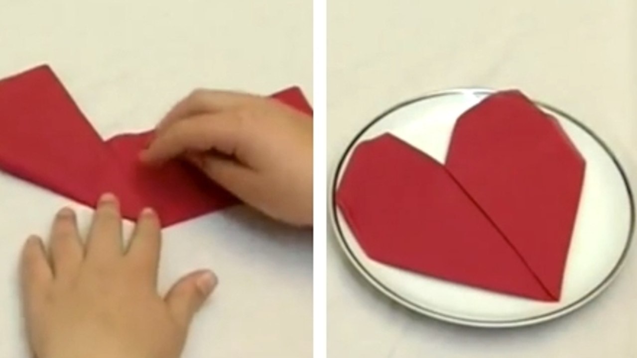 Réalisez facilement un pliage en cœur pour vos serviettes. Vos invités n'en reviendront pas !