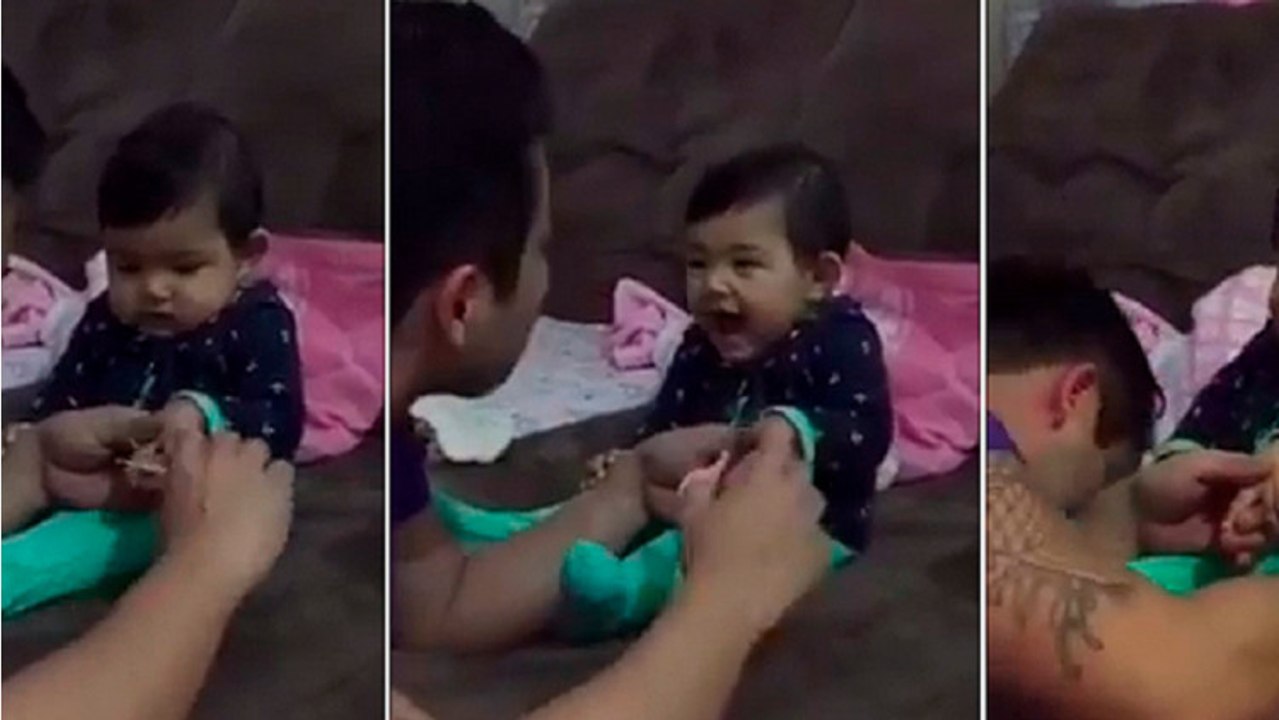 Son papa essaye de lui couper les ongles et là... son bébé lui fait une blague trop mimi !