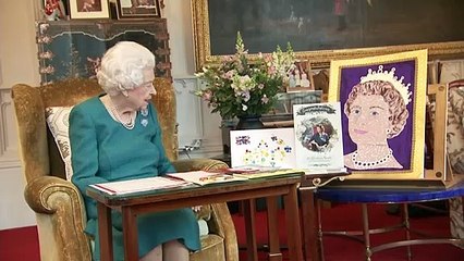 Queen beams at Jubilee well-wishes - and pet dog joins in!