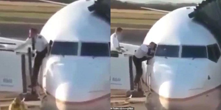 Pilot Who Was Squeezing His Way Through The Cockpit Window At Heathrow Airpport Is Caught On Camera