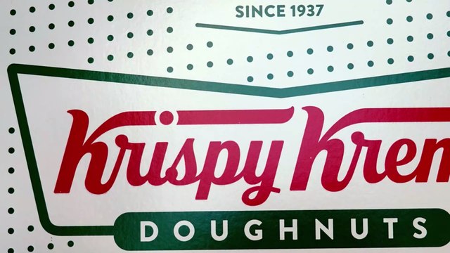 Krispy Kreme is offering football fans a dozen free donuts only today