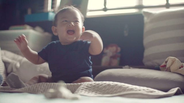 Baby diagnosed with life-threatening tumour after he stopped laughing