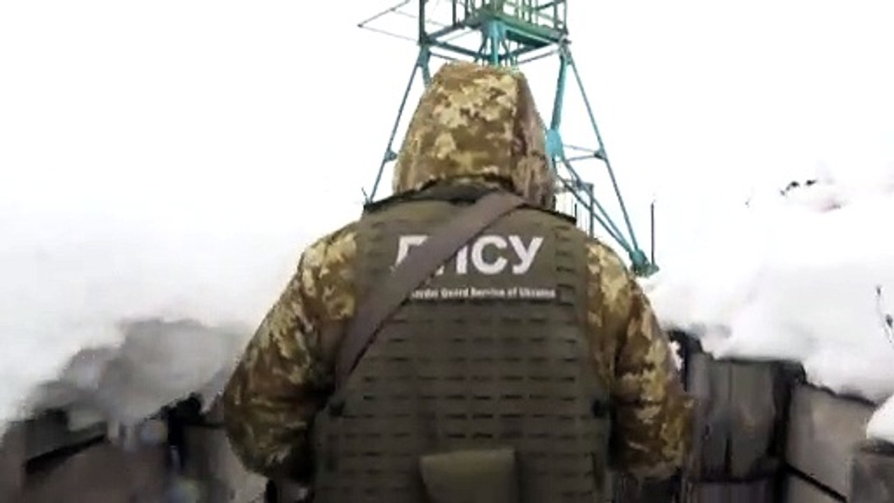Ukrainian border guards patrol the border with...