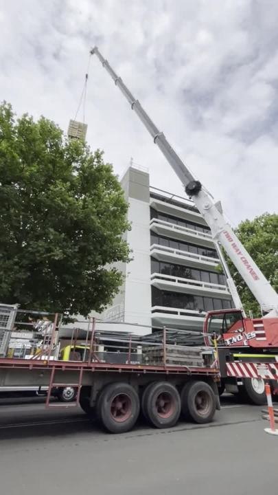 Market Street is blocked off as a massive crane starts work on the Kells building revamp