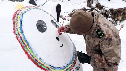 Soldiers Show Olympic Support With Snow Bing Dwen Dwen Sculpture
