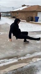 Texan Attempts Skateboarding on Ice