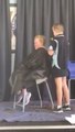 Kaila shaving off Ace's hair at their fundraiser