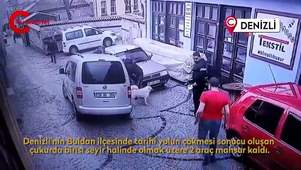Seyir halindeki araç çöken yolun içine düştü
