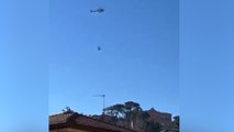 Bologna, il video dell'elicottero che perde il carico in volo
