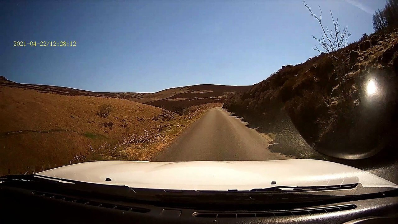 Driver Collides with Cyclist on Narrow Road