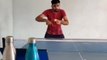 Guy Performs Cool Ping Pong Trick Shot By Hitting Cup on Table Tennis Table