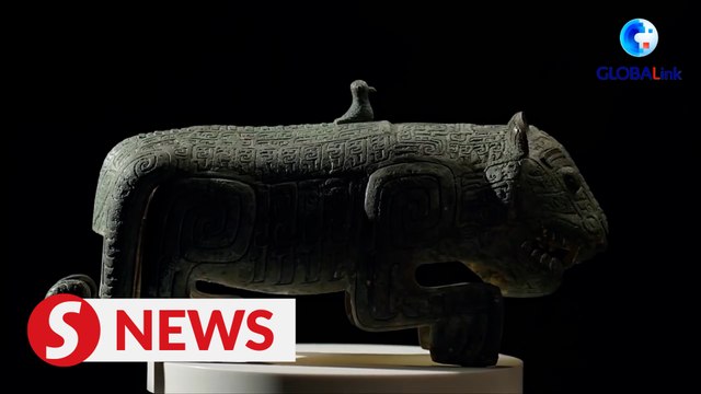 Two-tailed bronze tiger roars into Lunar New Year