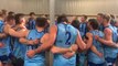 Penguin players singing the club song after its NWFL win over Latrobe