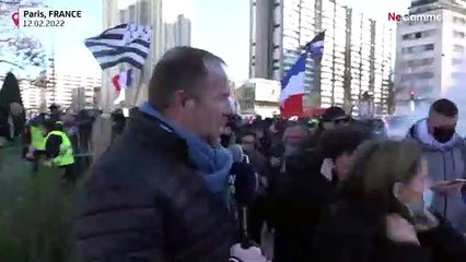 Reporter struggles as police use tear gas to break up demonstration