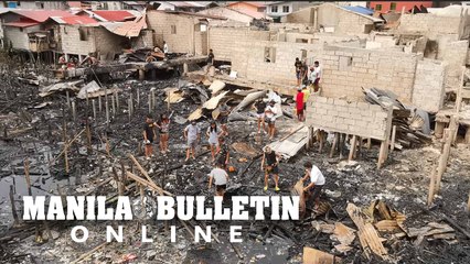 Residents recover their belongings after a fire razed their homes