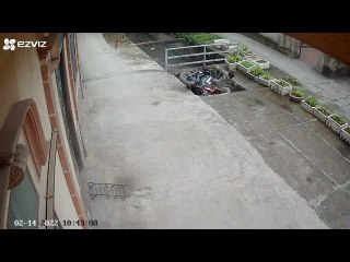 Man Transporting Heavy Load Falls Through Concrete