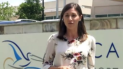 Man charged after woman's body found at resort