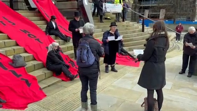 Extinction Rebellion stage mock funeral in Leeds