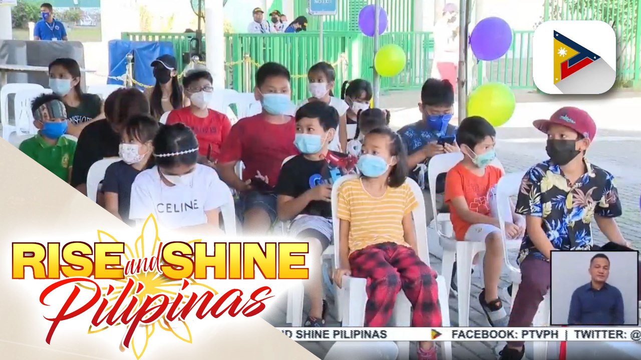 Mga batang binakunahan sa amusement park sa Lag...