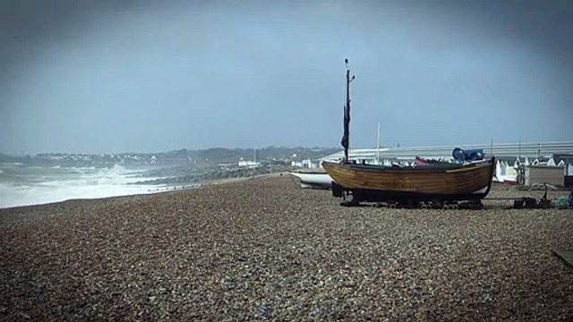 Waves crashing against the beach in St Leonards