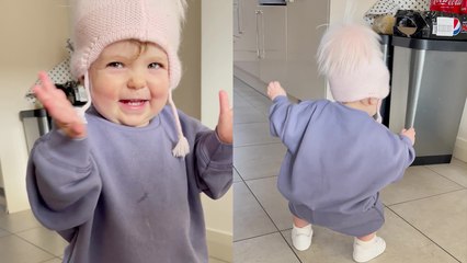 '16-month-old baby girl turns on the music and does a happy dance'