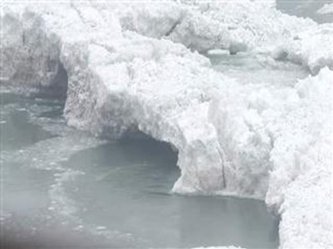 Water still cascades over nearly frozen Niagara Falls